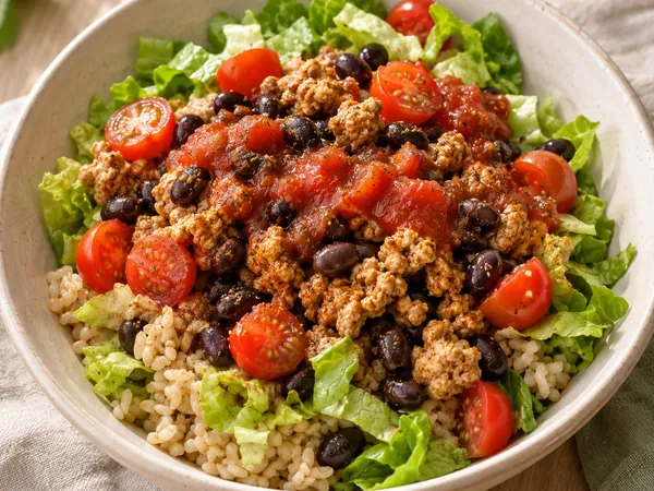 AI-generated serving illustration of Turkey taco lettuce-and-rice bowls