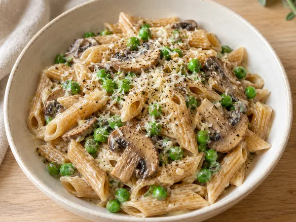 AI-generated serving illustration of Mushroom & pea pasta
